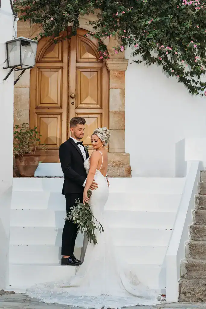 Bride & groom posing in an editorial style photograph at a destination wedding